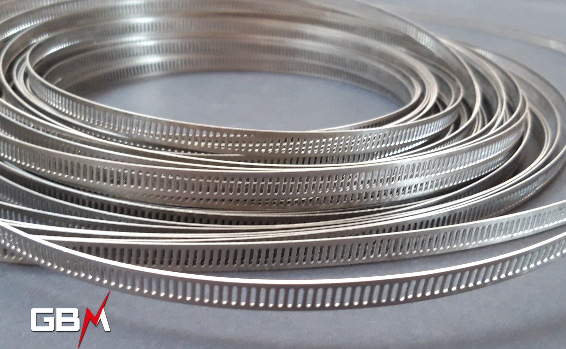 Collier de serrage Inox bande ajourée sans fin largeur 13 mm – bobine de 30m